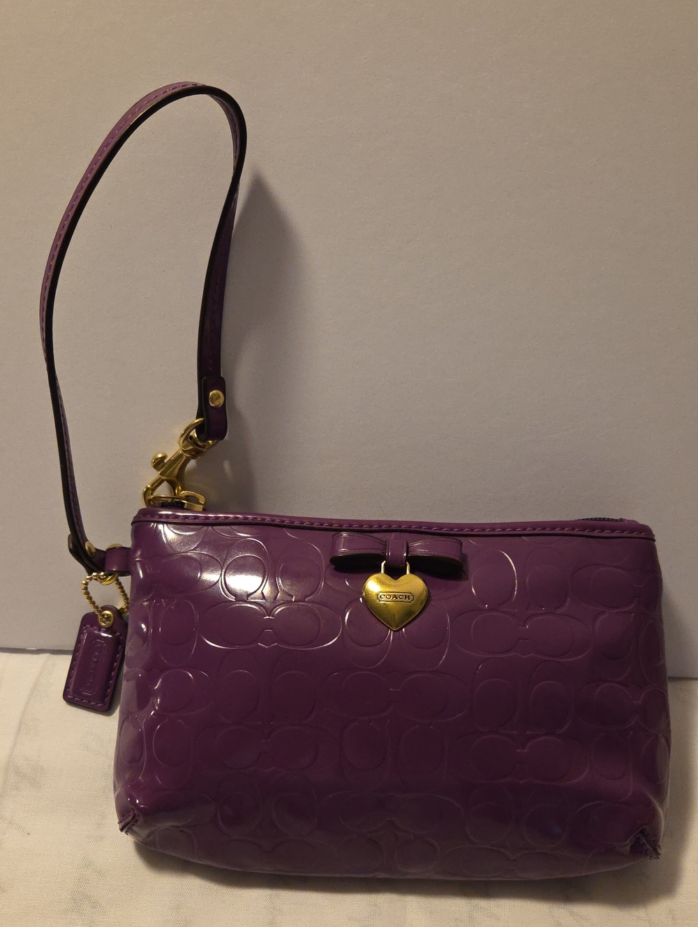 Coach Signature Purple Patent Wristlet with Gold Heart Charm and Bow